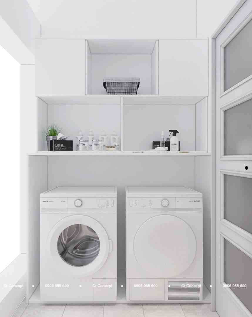 Khu vực giặt sấy gọn gàng với hệ tủ kệ trắng trong thiết kế căn hộ Phú Hoàng Anh.