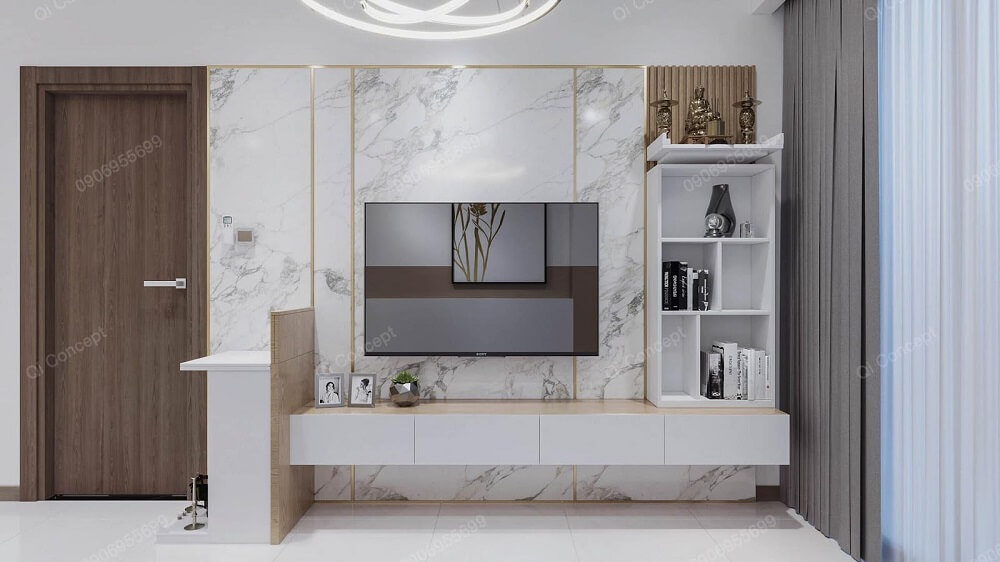 Mảng tường tivi được ốp PVC giả đá, nhấn nhá cùng các đường nét mạ vàng tinh tế