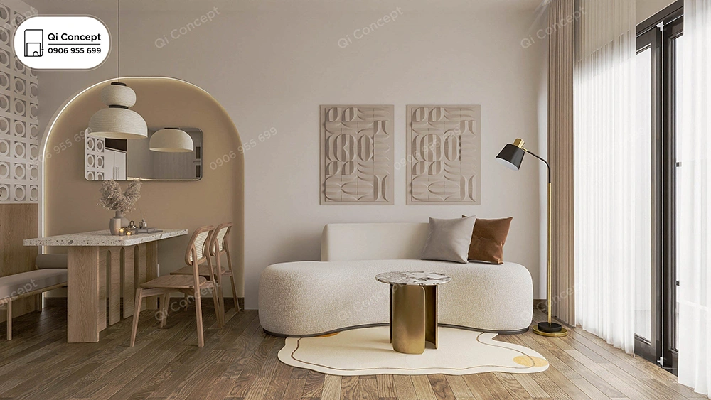 Thiết kế nội thất nhà phố phong cách Japandi với sofa cong, bàn ăn mặt đá terrazzo và hốc tường hình vòm.