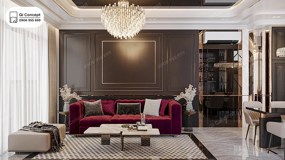 Thiết kế nội thất nhà phố cao cấp với sofa nhung đỏ và đèn chùm pha lê lớn.