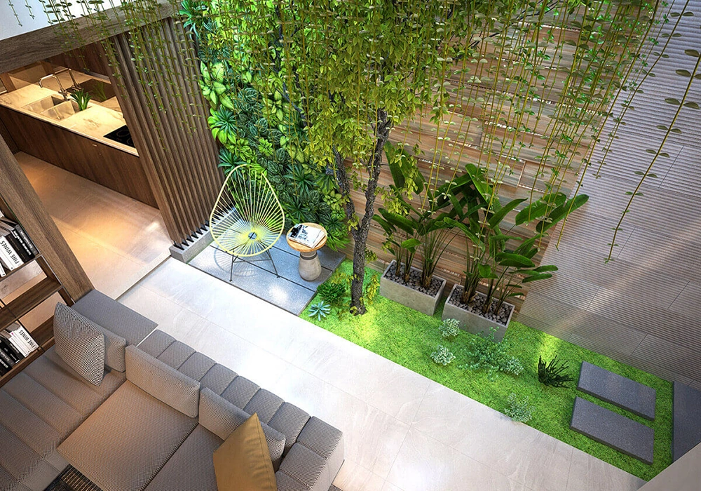 Thiết kế nội thất nhà 2 tầng với giếng trời và sân vườn trong nhà.