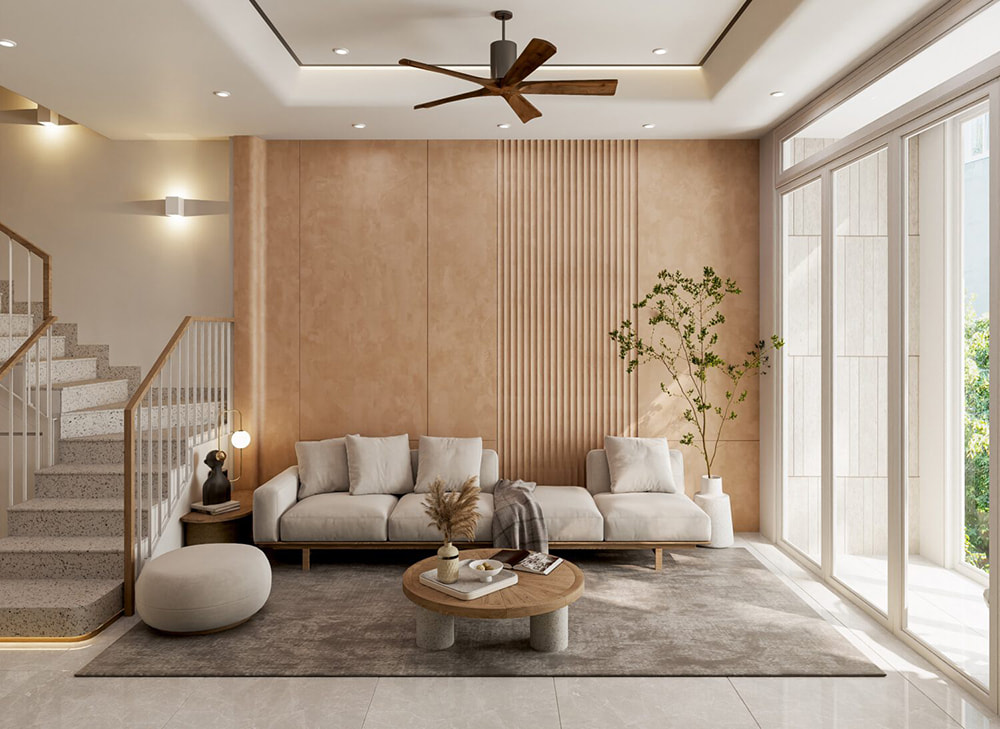 Phòng khách tối giản trong thiết kế nội thất biệt thự liền kề, sử dụng tông màu be và vật liệu tự nhiên.
