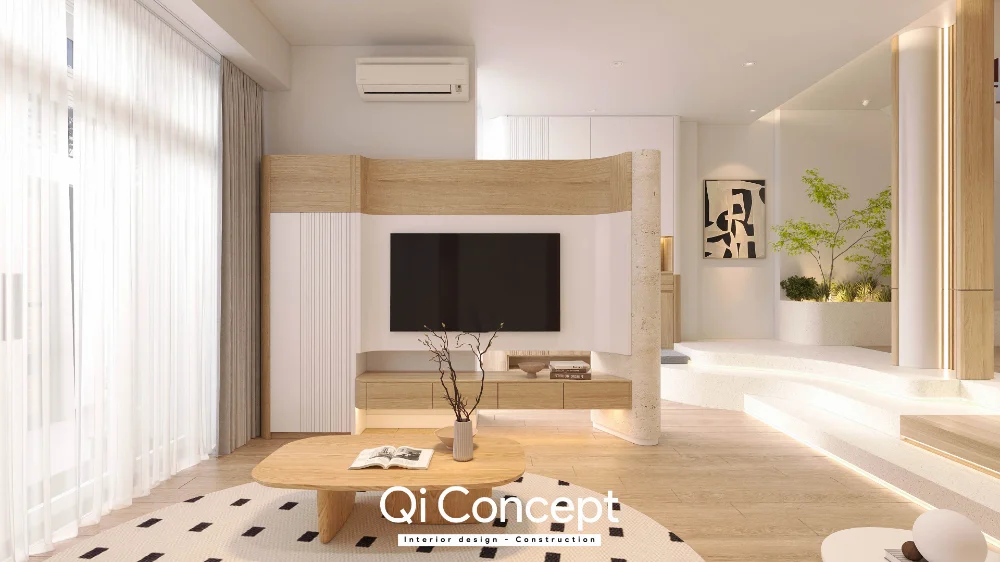 Mảng TV tông gỗ sáng cạnh cửa kính và bậc chuyển cao độ trong phòng khách