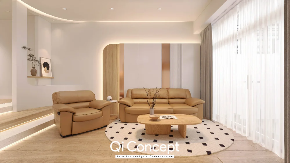 Sofa nâu và ghế đơn trên thảm tròn cạnh cửa kính phòng khách