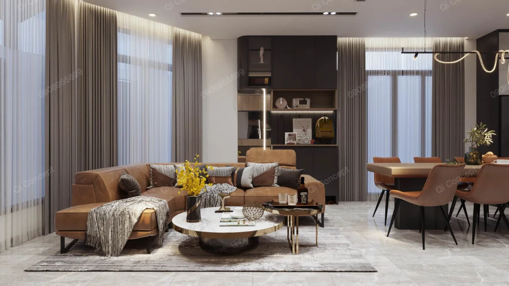 Sofa góc màu nâu và bàn trà tròn trong phòng khách nhà phố Phú Nhuận